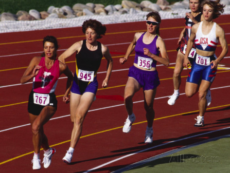 Female runners competing on track